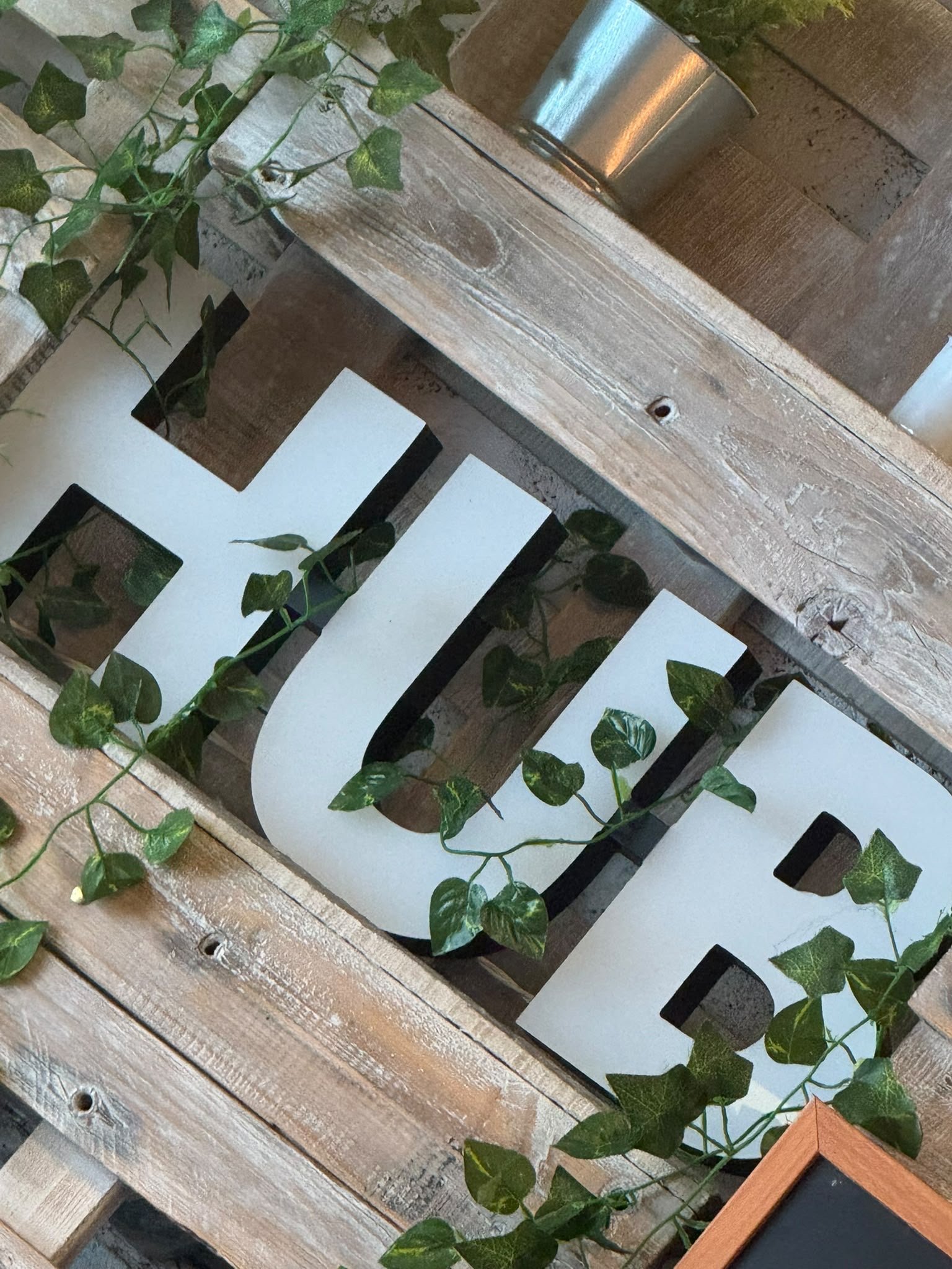 The Hub lettering and interior greenery